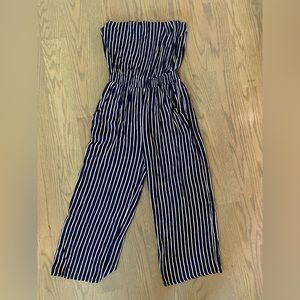 Navy blue, white stripped, sleeveless romper. Also has pockets